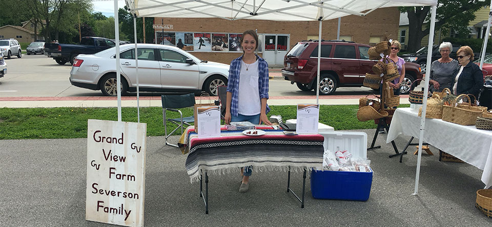 Amanda at the first farmers market for Grand View Beef in 2017