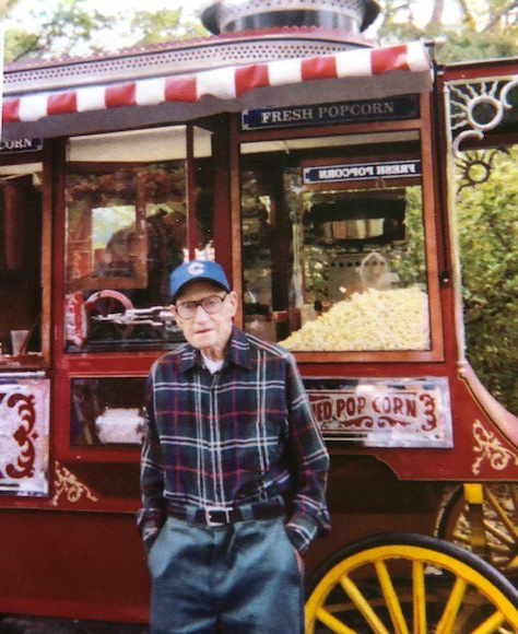 Dale standing in front of a popcorn cart