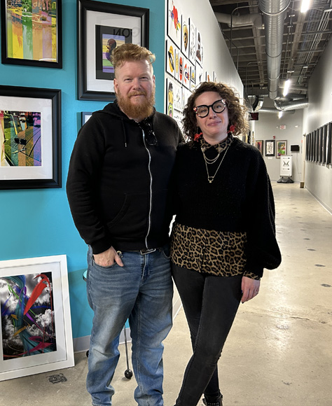 Sarah Booz and Kyle Kirwin pose for a photo at Mainframe Studios