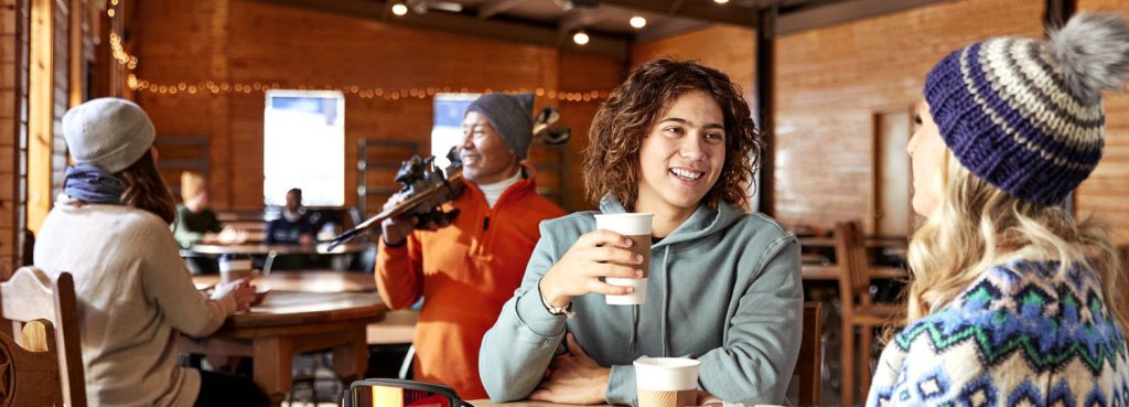 Young adult male enjoying a cup of coffee.