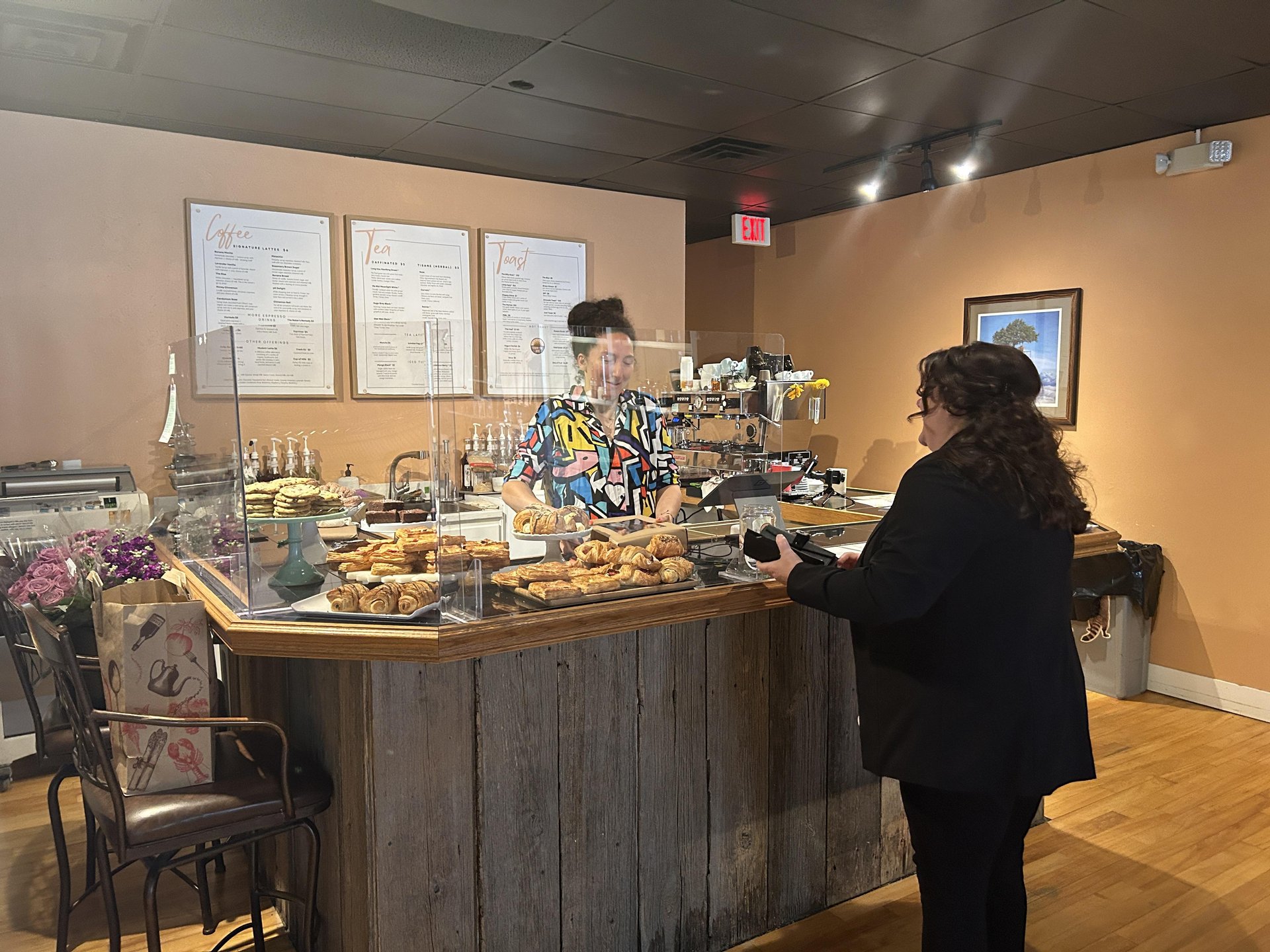 Savor the Rise owner Deja Keppler serving a customer