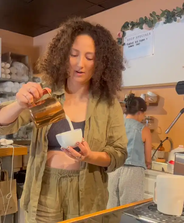 Deja Keppler pours a latte