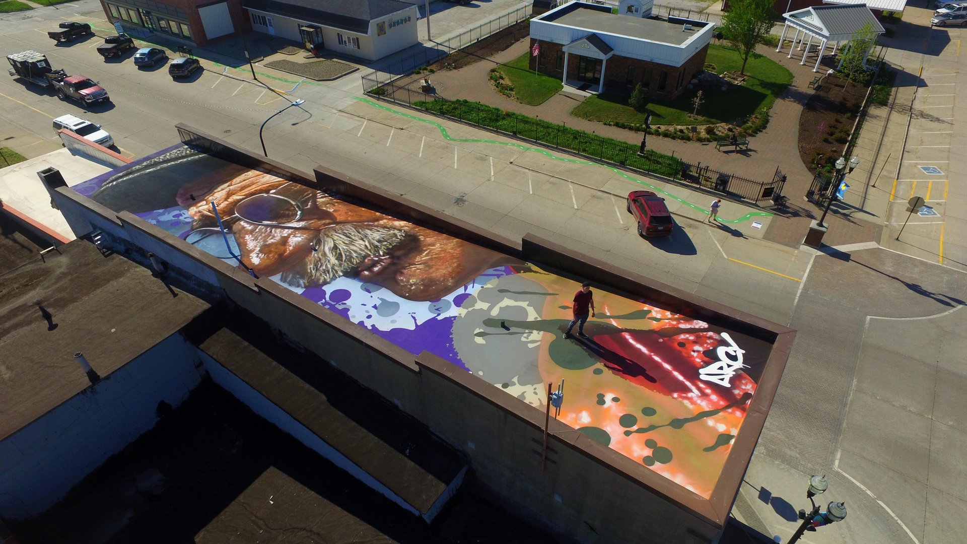 rooftop mural of a mans face