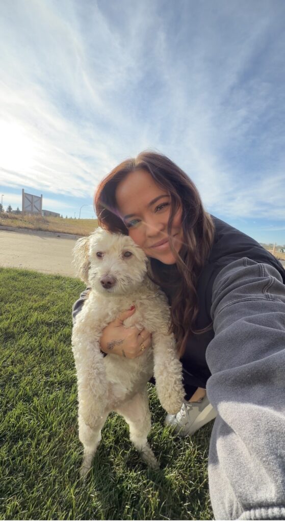 Tiffany Koithan posing with her dog