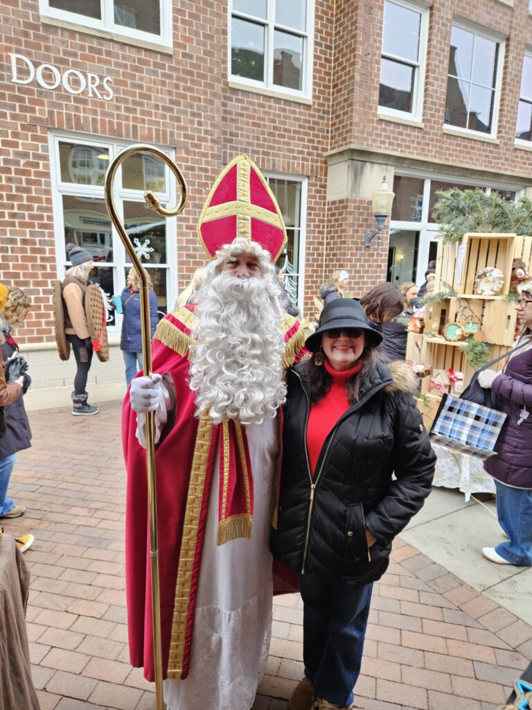 a woman and a man in a dutch christmas costume