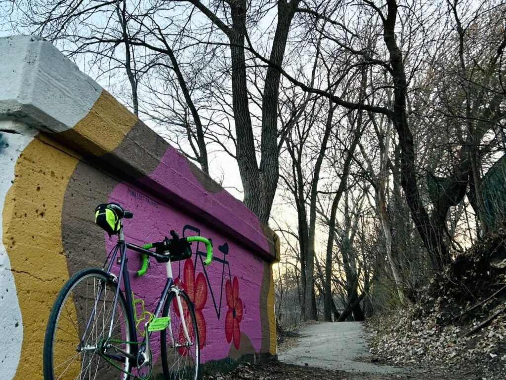a bike resting on a mural in on a trail in Mason City, Iowa